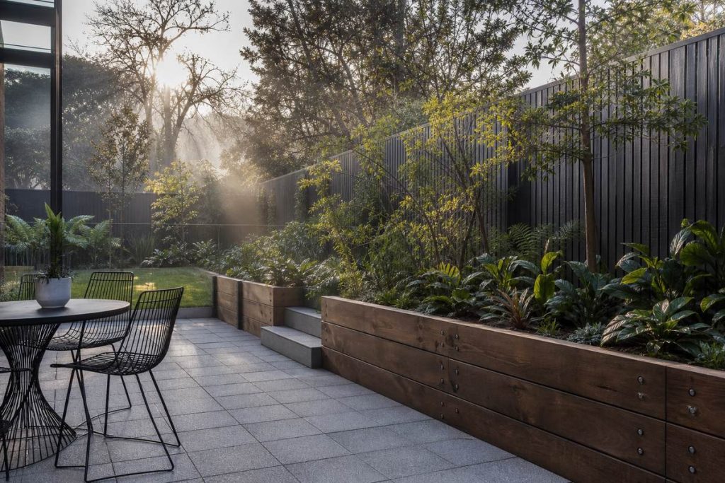 Melbourne backyard patio with pavers and retaining wall prepared for winter weather